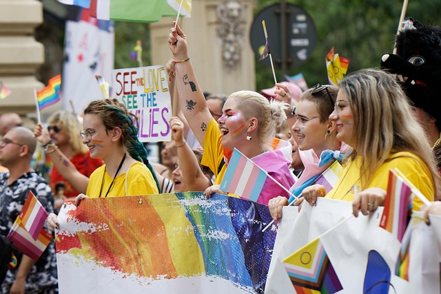 Colorful street parade during a Spanish festival with people in traditional dress.